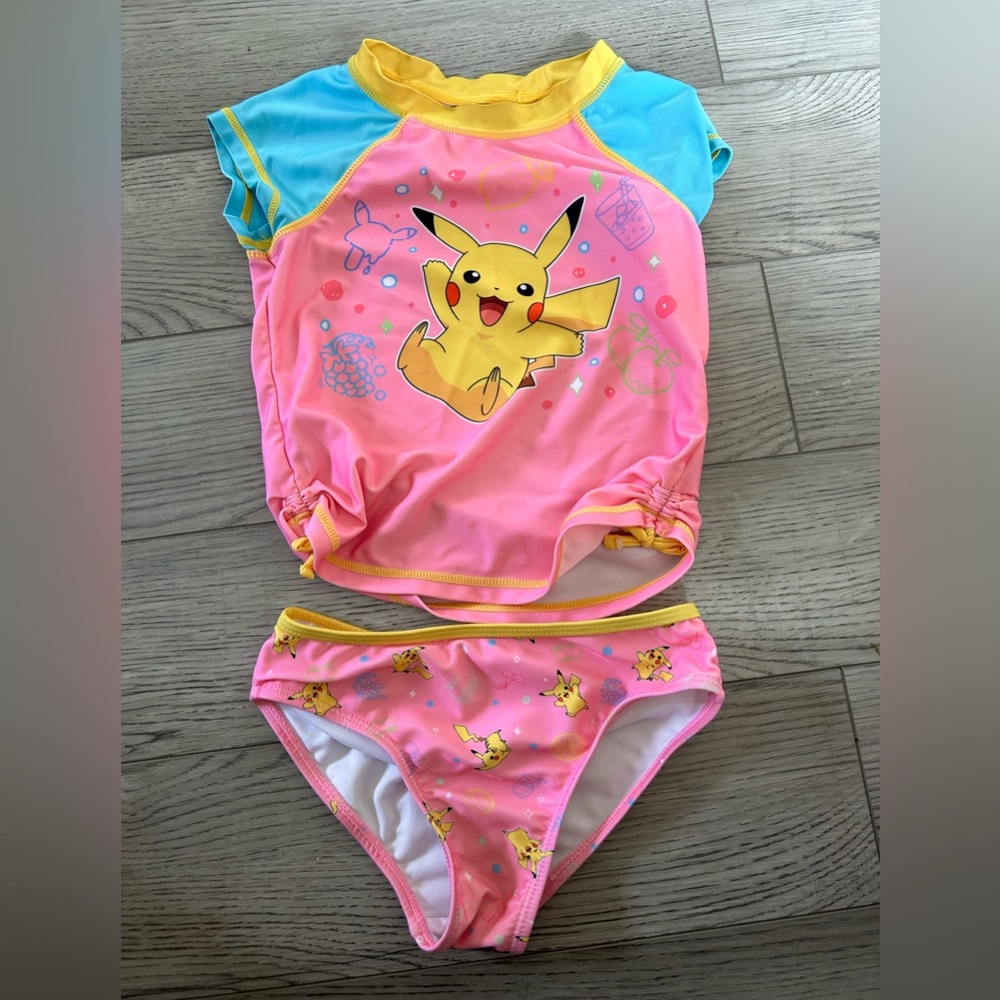 Girls two piece pink Pikachu swim suit.